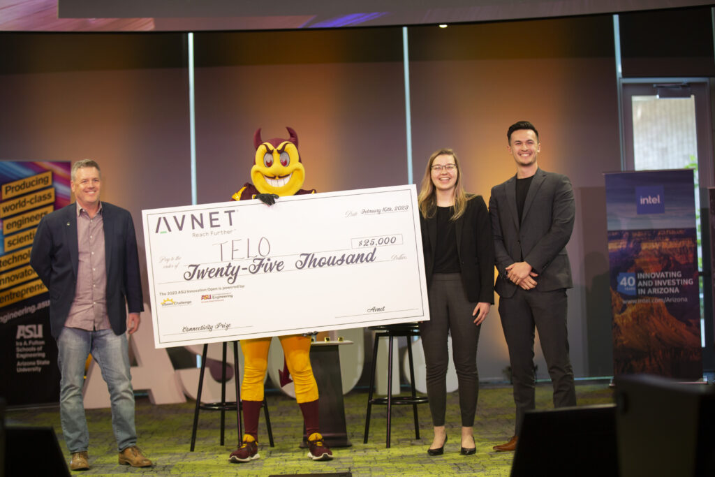 Scott Tippin presents the $25,000 Connectivity prize to Telo co-founders Morgan Kerfeld and Steven Bleau.
