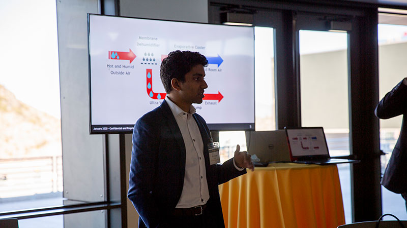 Entrepreneur student pitching his invention in front of a podium